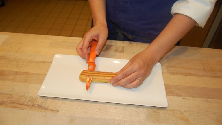 Éclair recipe from Bouchon Bakery 29 Take your cooled éclair and carefully slice off the top and discard it.