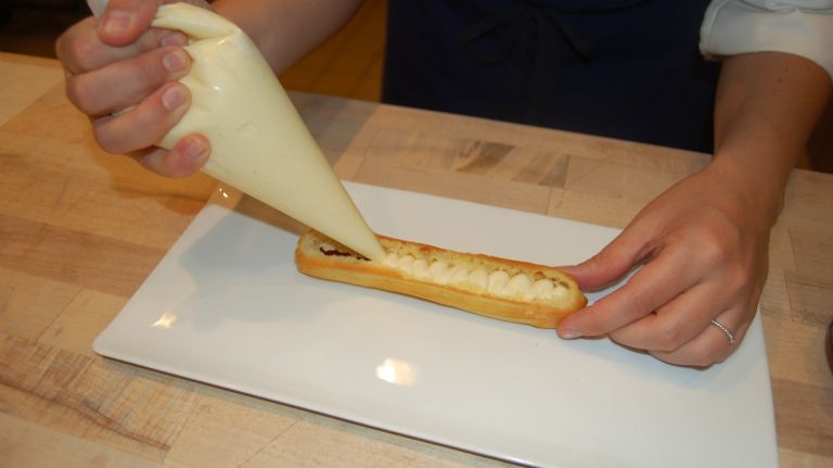 Éclair recipe from Bouchon Bakery 31 Take your pastry bag of diplomat crème, which is a mixture of pastry cream and whipped cream, and fill the remaining space of the éclair. (Note: Bouchon makes its own diplomat crème, but any quality vanilla pudding will do.)