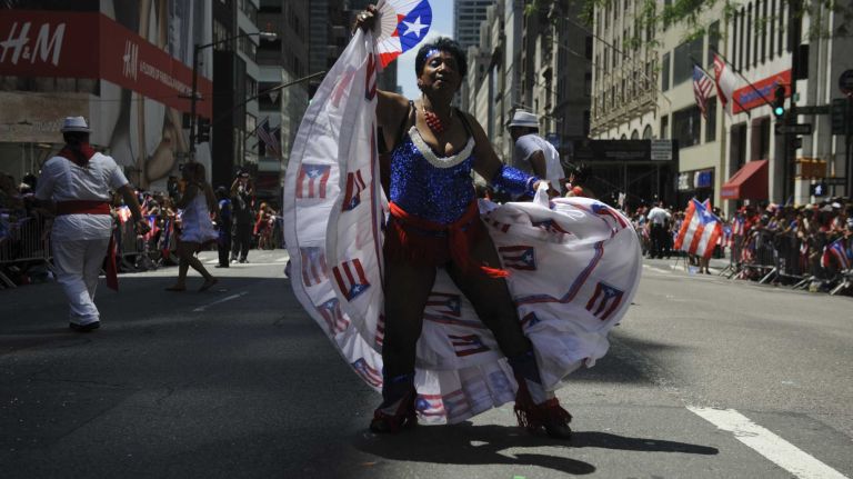 Participants march and dance during the 57th annual National Puerto Rican Day Parade in Manhattan on Sunday, June 8, 2014.