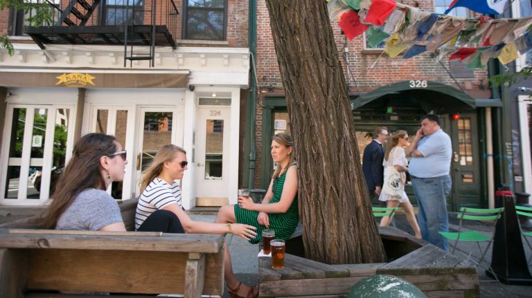 Kelsey Delmote, Tenley Allen, and Colleen Hanson grab a drink at the Earn Inn in Hudson Square in Manhattan on June, 1, 2014. 
