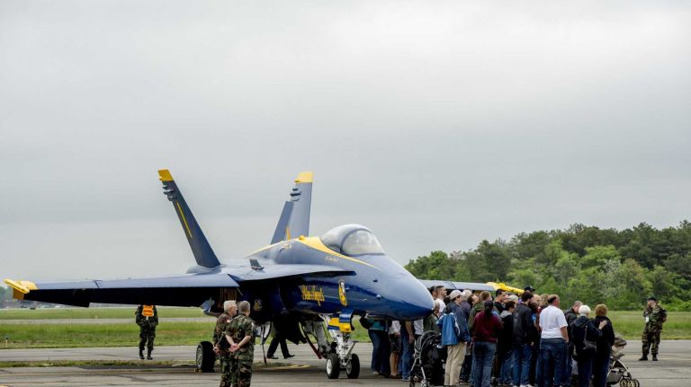 Jones Beach Air Show 2014 22 Employees of Northrop Grumman take a group photo next to a Blue Angel at Republic Airport in Farmingdale on May 23, 2014.