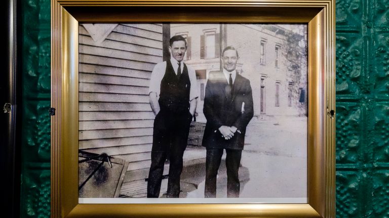 The bar's almost 200-year history is sprawled across its walls in the form of photographs and relics.