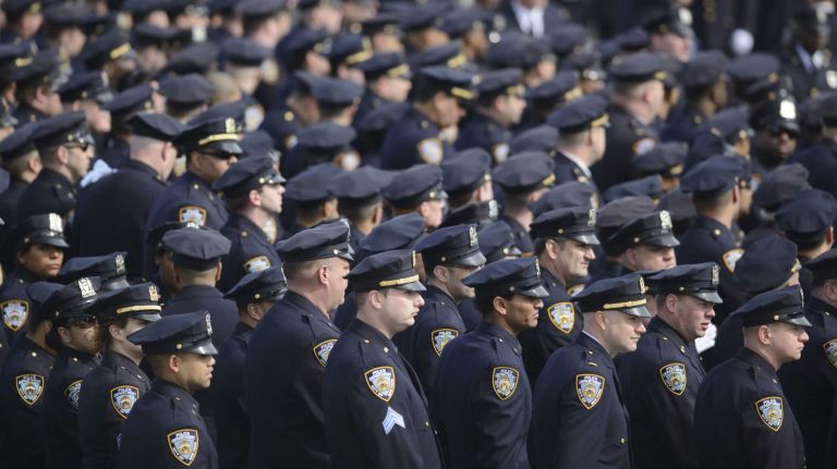NYPD Officer Dennis Guerra remembered at memorial, funeral 38 Police line up at St. Rose of Lima Roman Catholic Church for the funeral Mass for fallen NYPD Officer Dennis Guerra on Monday, April 14, 2014. Guerra, 38, died early Wednesday, April 9, of smoke inhalation and carbon monoxide poisoning after he and fellow officer Rosa Rodriguez were overcome by dense smoke and toxic fumes in a Coney Island high-rise fire on April 6.