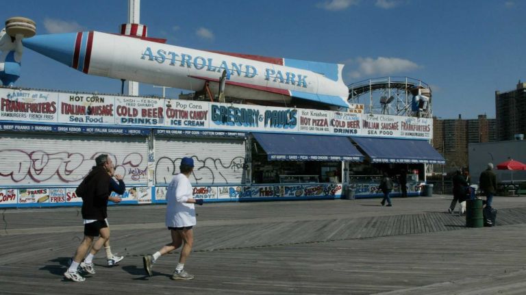 Runners pass Astroland Park on the Boardwalk in Coney Island on Sunday, March 28, 2004. 