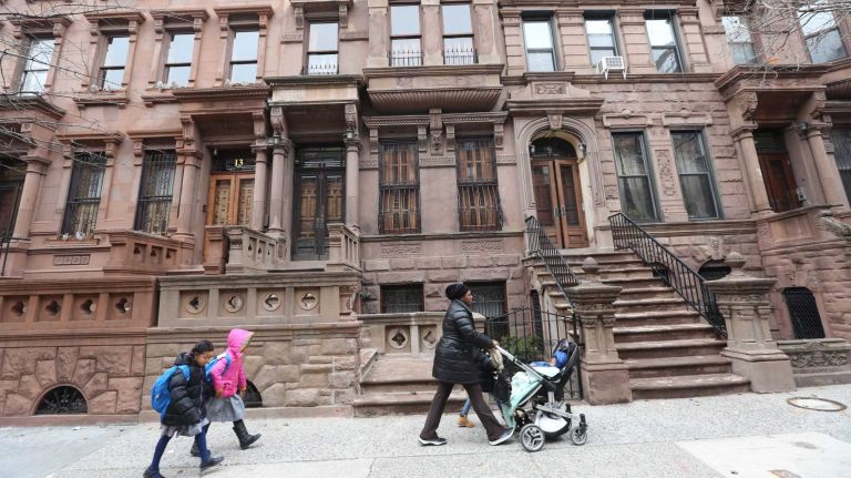 Houses along 121st street between Mount Morris Park West and Malcolm X Blvd. in Harlem, Wednesday, April 2, 2014.