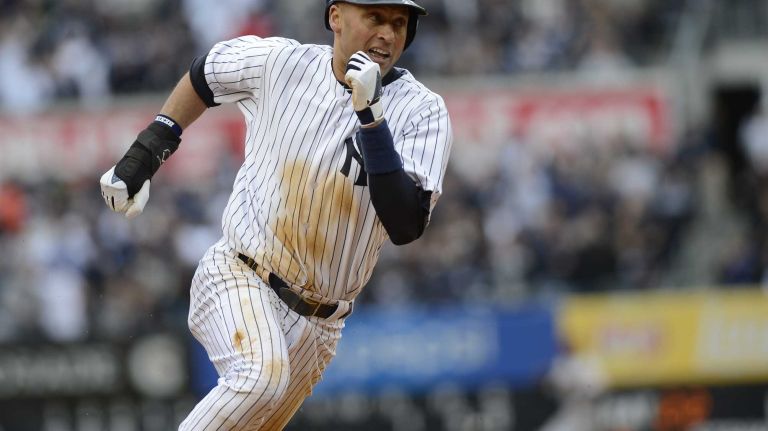 New York Yankees Derek Jeter rounds third as he comes home on a Jacoby Ellsbury RBI in the 5th inning of his home opener against the Baltimore Orioles at Yankee Stadium on April 7, 2014.