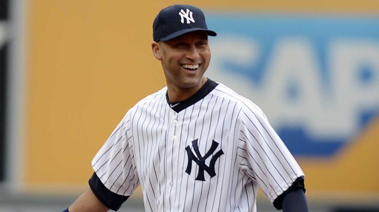 Derek Jeter smiles on the field during the first inning of the Yankees