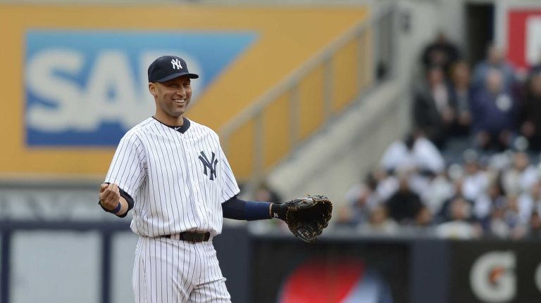 Derek Jeter smiles on the field during the first inning of the Yankees' home opener against the Baltimore Orioles at Yankee Stadium on April 7, 2014.