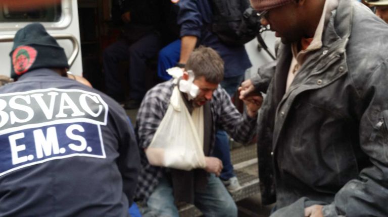 East Harlem explosion 13 An injured person is treated at the scene of an explosion in East Harlem on Wednesday, March 12, 2014.