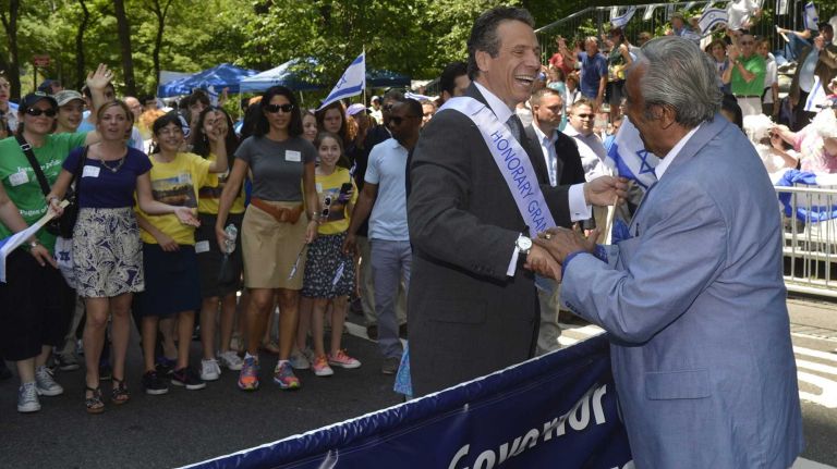 New York Gov. Andrew M. Cuomo greets Rep. Charles Rangel (D-Harlem) during the Celebrate Israel Parade in Manhattan. (June 2, 2013)