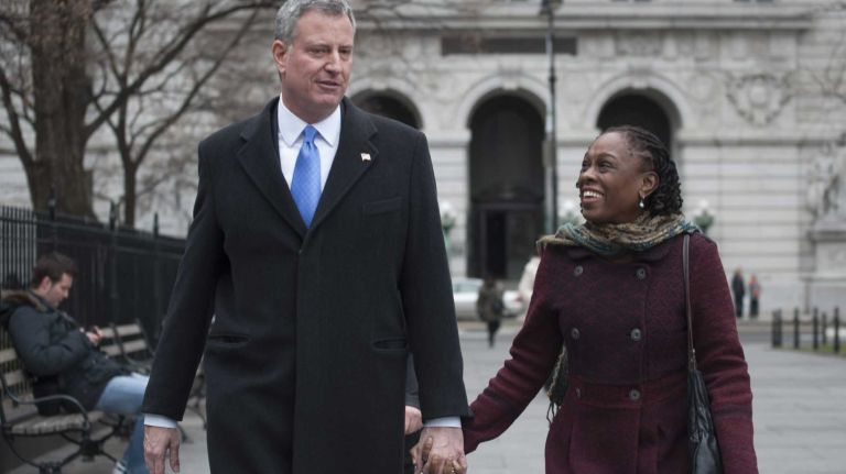 Mayor-elect Bill de Blasio and his wife Chirlane McCray walk to City Hall after he announced five new appointments to his administration on Dec. 31, 2013.