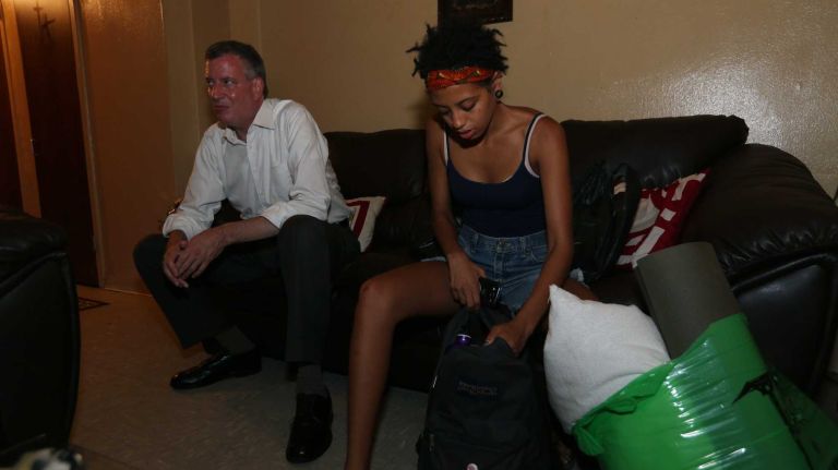 Democratic mayoral candidate Bill de Blasio and his daughter Chiara prepare to spend the night of July 20, 2013 at the home of Katherine Wilson in the Lincoln Houses in Harlem in an effort to highlight the poor conditions in the New York City public housing system.
