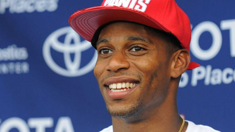 Victor Cruz buying $8,000 worth of art by Brooklyn’s Mark Anthony Green at a party thrown by Heineken for Green’s debut exhibition, “Vibes Are the Only Currency,” at Poppington Gallery.