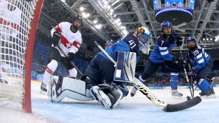 Phoebe Stanz #88 of Switzerland scores a goal in the second period against Noora Raty #41 of Finland during the Women's Ice Hockey Preliminary Round Group A game on day five of the Sochi 2014 Winter Olympics at Shayba Arena on Wednesday, Feb. 12, 2014.
