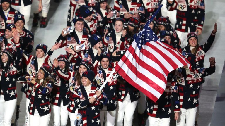 Nordic combined skier Todd Lodwick of the United States Olympic team carries his country's flag during the opening ceremony of the Sochi 2014 Winter Olympics at Fisht Olympic Stadium in Sochi, Russia, on Friday, Feb. 7, 2014.