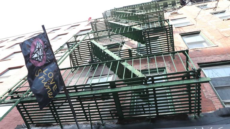 Exterior banner of the store Love Shine at 543 E. 6th street. 