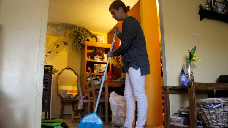 NYCHA tenant says surviving winter during heat outages was like ‘living in Antarctica’ 3 Lisa Vasquez, 24, sweeps paint chips off the floor in her New York City Housing Authority apartment in the South Beach Houses in Staten Island on Wednesday.