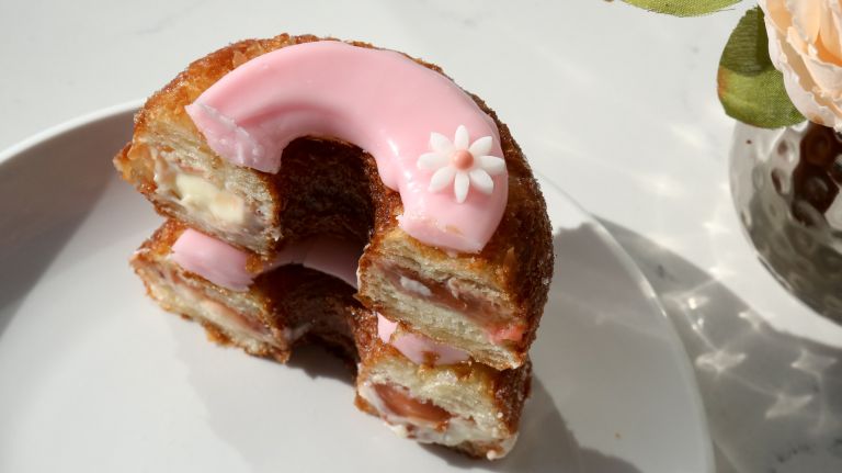 A Cronut with mascarpone ganache and rhubarb rose fondant.