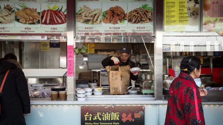 Food stands and grand dining rooms alike line the streets of Flushing, Queens.