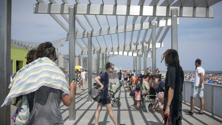 Hurricane Sandy destroyed much of the boardwalk at Rockaway Beach, but a new one was built. 