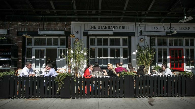 Diners lunch outside at the Standard Hotel. 