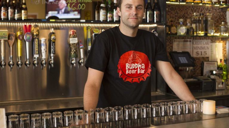 Tim Haring poses for a photo inside Buddha Beer Bar. (Jul. 9 , 2013)