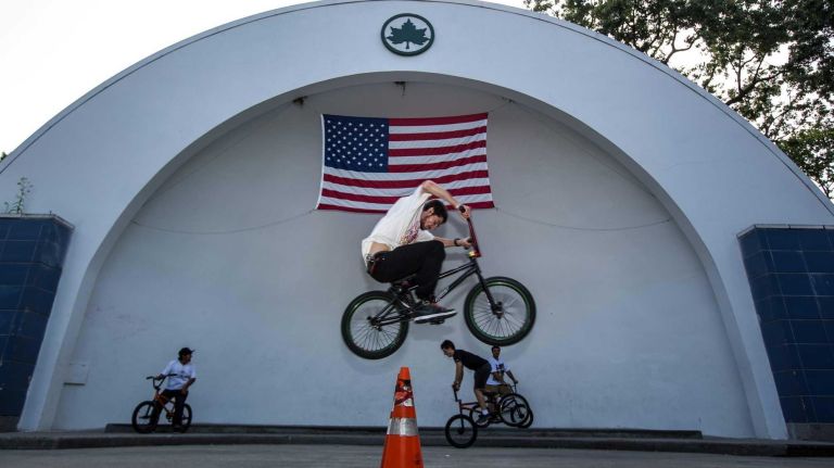 Robert Thoerich, 20, uses his bike to jump over cones at the George Seuffert Sr. Bandshell in Forest Park. (Aug. 29, 2013)