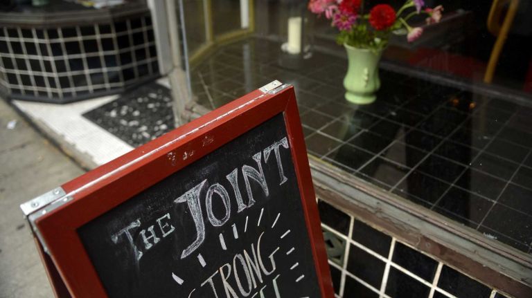 A chalkboard sign for The Joint, 471 Myrtle Ave. (August 10, 2013)