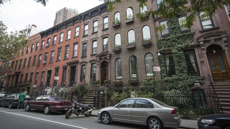 Hell's Kitchen 17 Homes on West 44th Street in Hell's Kitchen in Manhattan. The neighborhood, once a playground for gangs, is now a hot spot for foodies and for tourists. (Oct. 4, 2013)