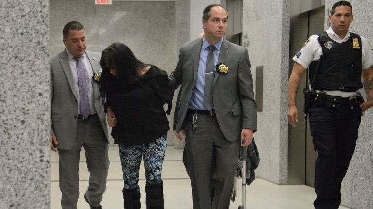 Dorothy Bruns, shown heading into court Thursday, has been charged with two counts each of second-degree manslaughter, criminally negligent homicide and reckless endangerment, among other charges. 