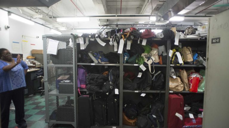 Melissa Gissentanner, the manager at the MTA's Metro-North Railroad Lost & Found in Grand Central Terminal, shows stored items at the Lost & Found on August 28, 2013.