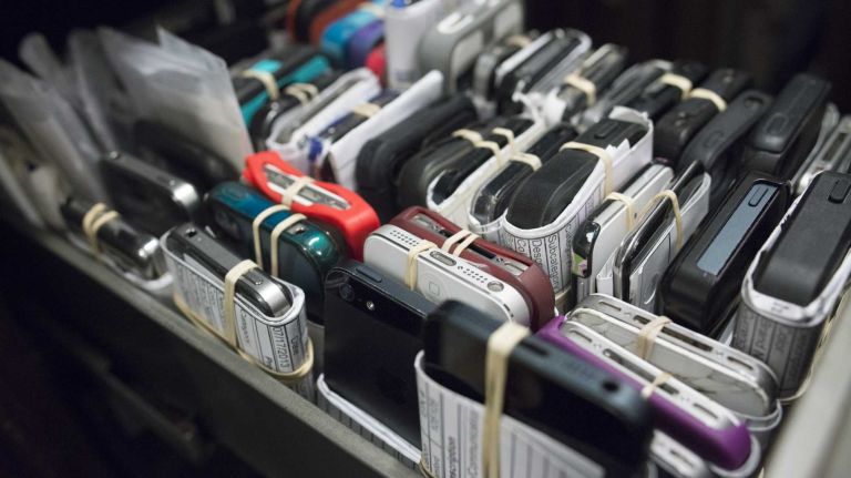 Lost iPhones are stored in a safe at the MTA's Metro-North Railroad Lost & Found in Grand Central Terminal on August 28, 2013.