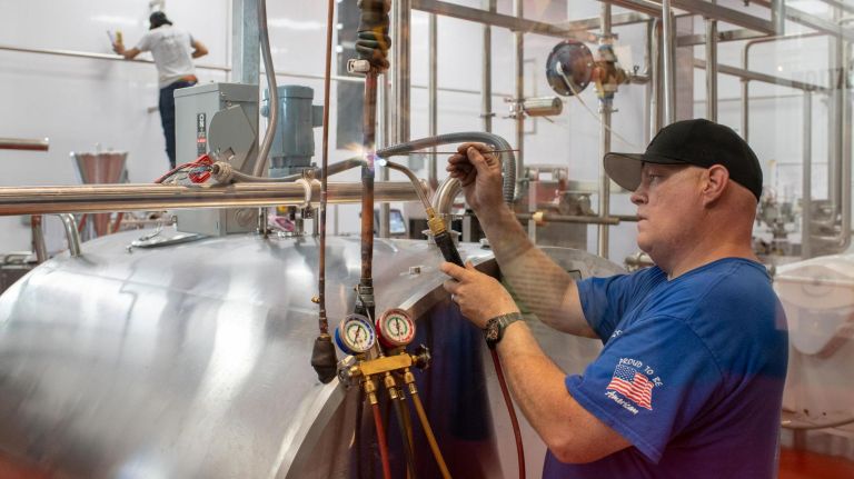Final work being done on the flavor vats inside the factory. Ample Hills is opening a new ice cream factory and museum in Red Hook. 421 Van Brunt St. Brooklyn, NY on July 24, 2018.