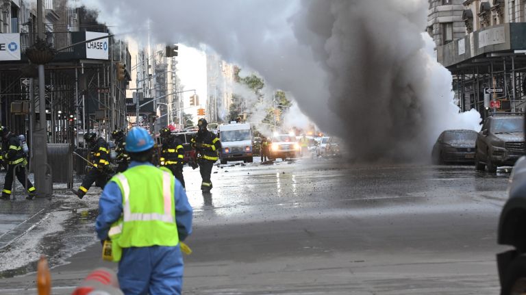Fifth Avenue fills with smoke after steam pipe explodes: Photos 10 Smoke billows from a steam pipe explosion on Fifth Avenue in Manhattan on Thursday.
