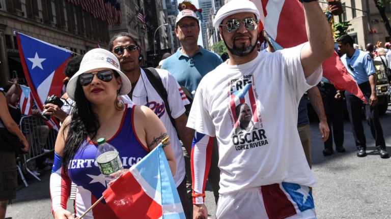 Participants march in the Puerto Rican Day Parade in Manhattan on Sunday, June 11, 2017.