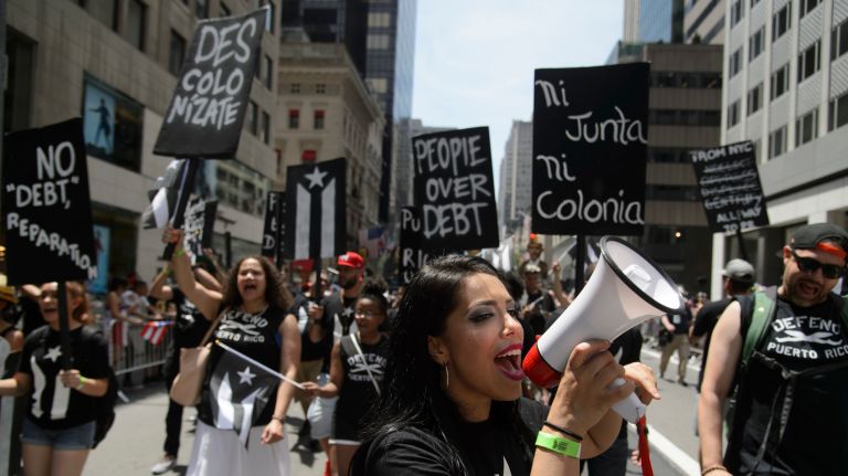 Supporters of Oscar López Rivera march down Fifth Avenue during the Puerto Rican Day Parade on Sunday, June 11, 2017.