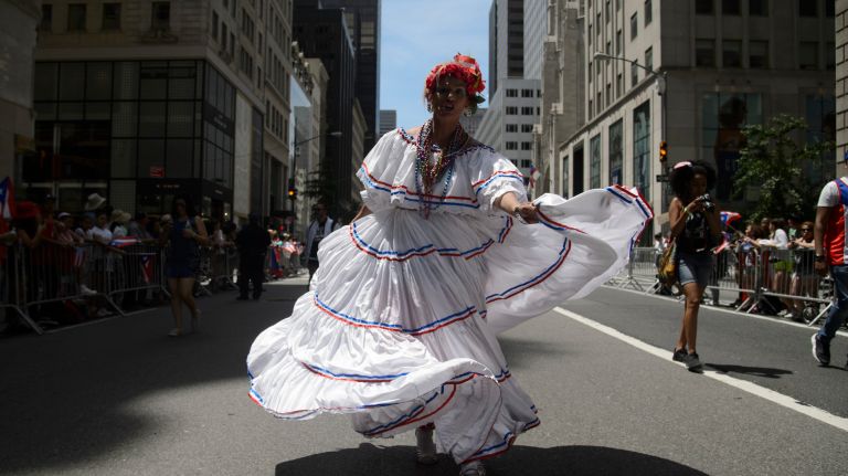 A participant dances during the 60th annual Puerto Rican Day Parade in Manhattan on Sunday, June 11, 2017.