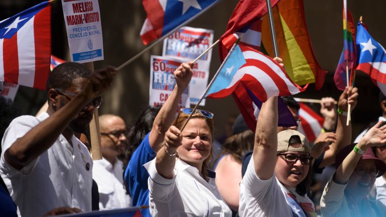 New York City Council Speaker Melissa Mark-Viverito, center, marches with fellow council members in the 60th annual Puerto Rican Day Parade in Manhattan on Sunday, June 11, 2017. 