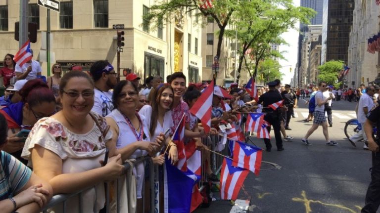 Attendees of the Puerto Rican Day Parade gather along Fifth Avenue on Sunday, June 11, 2017. 