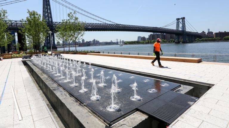 Sit by fountains as you gaze at Manhattan.
