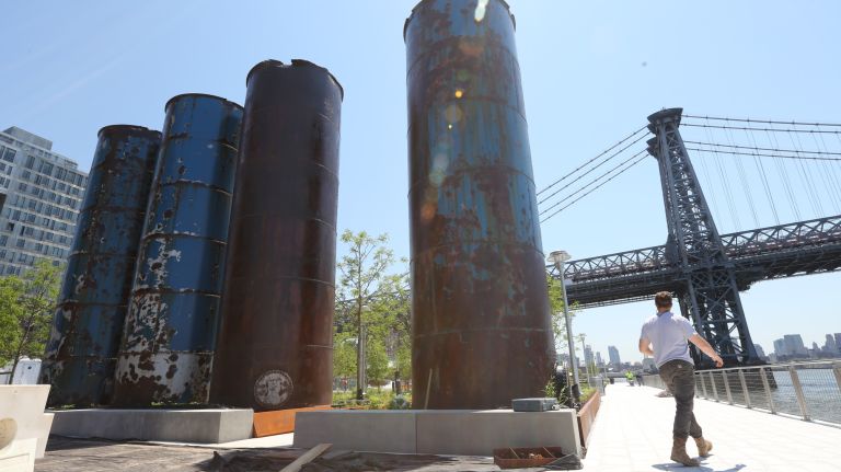 Tanks used to collect syrup at the Domino Sugar Refinery are used as a design element.