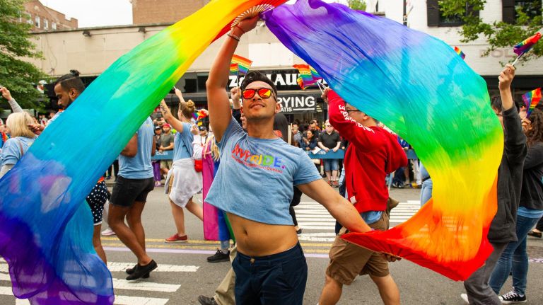 Queens Pride Parade injects color into an otherwise cloudy day 13 Marchers wave colorful flags at the 26th annual Pride Parade and Festival.