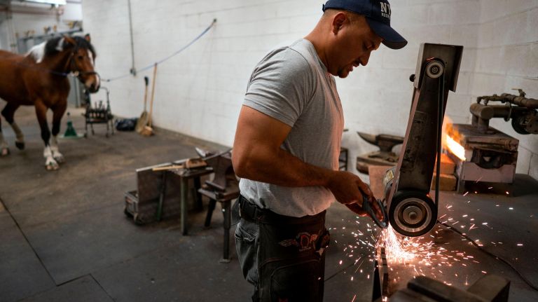 Martinez prepares the shoe for Centennial.