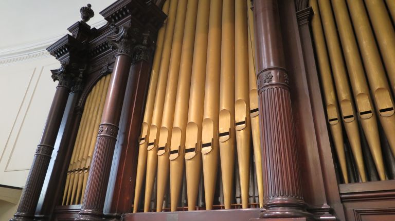 The original organ from 1849 was operated by pumping water into it, but it was replaced with a new one in 1866, which was updated over the next century. With 4,000 pipes and a large structure, its been retrofitted over time to keep it from toppling over or sinking down. Now safely secure, the instrument's vibrations can be felt by the choir on stage. Those who take the tour this weekend will be able to peek inside a secret door to see the pipes up close and listen to the church's organist performing.