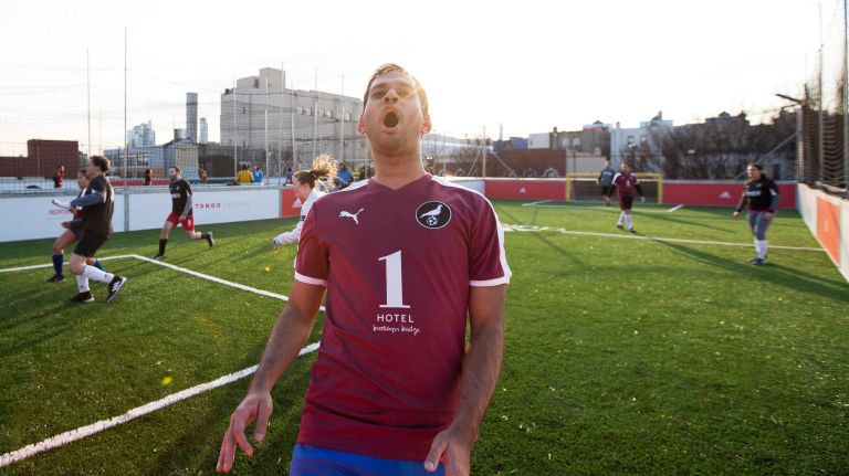 Rohan Thakur reacts after just missing a shot on goal at the Upper 90 rooftop soccer field.