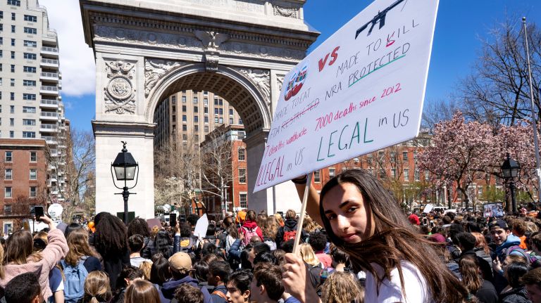 Student Tara Kerr of Manhattan, 16, joins other students from high schools and colleges, and some younger students as well, at Washington Square Park in Greenwich Village Friday, on the 19th anniversary of the Columbine High School shooting.