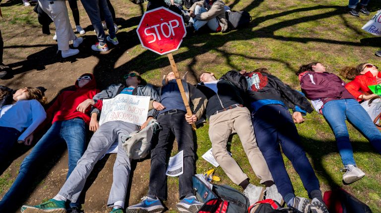 High school students take part in their own form of protest as others gathered to listen to speakers nearby in Washington Square Park in Greenwich Village on Friday.
