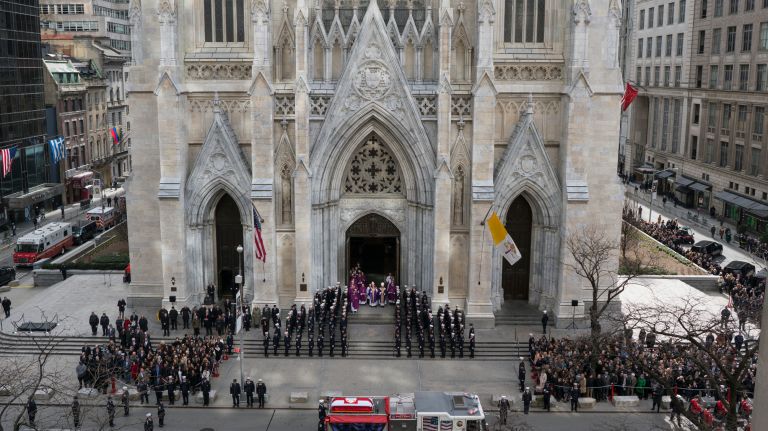 Firefighter Michael Davidson's casket is carried on an FDNY truck to St. Patrick's Cathedral on Tuesday.