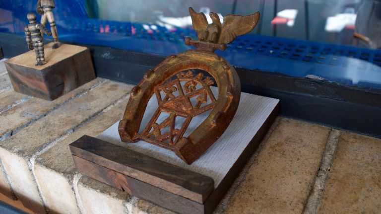 ...around the lounge's black-and-white-floored perimeter, you'll find this Freemasons horseshoe plaque (identifiable by the square and compasses emblem), dating from between 1945 and 1950.