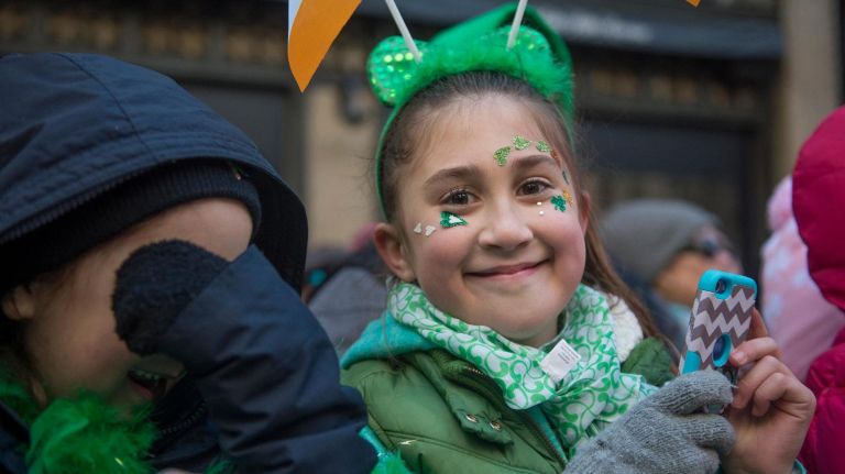 Kids watched the parade with their parents along Fifth Avenue in Manhattan on Saturday.